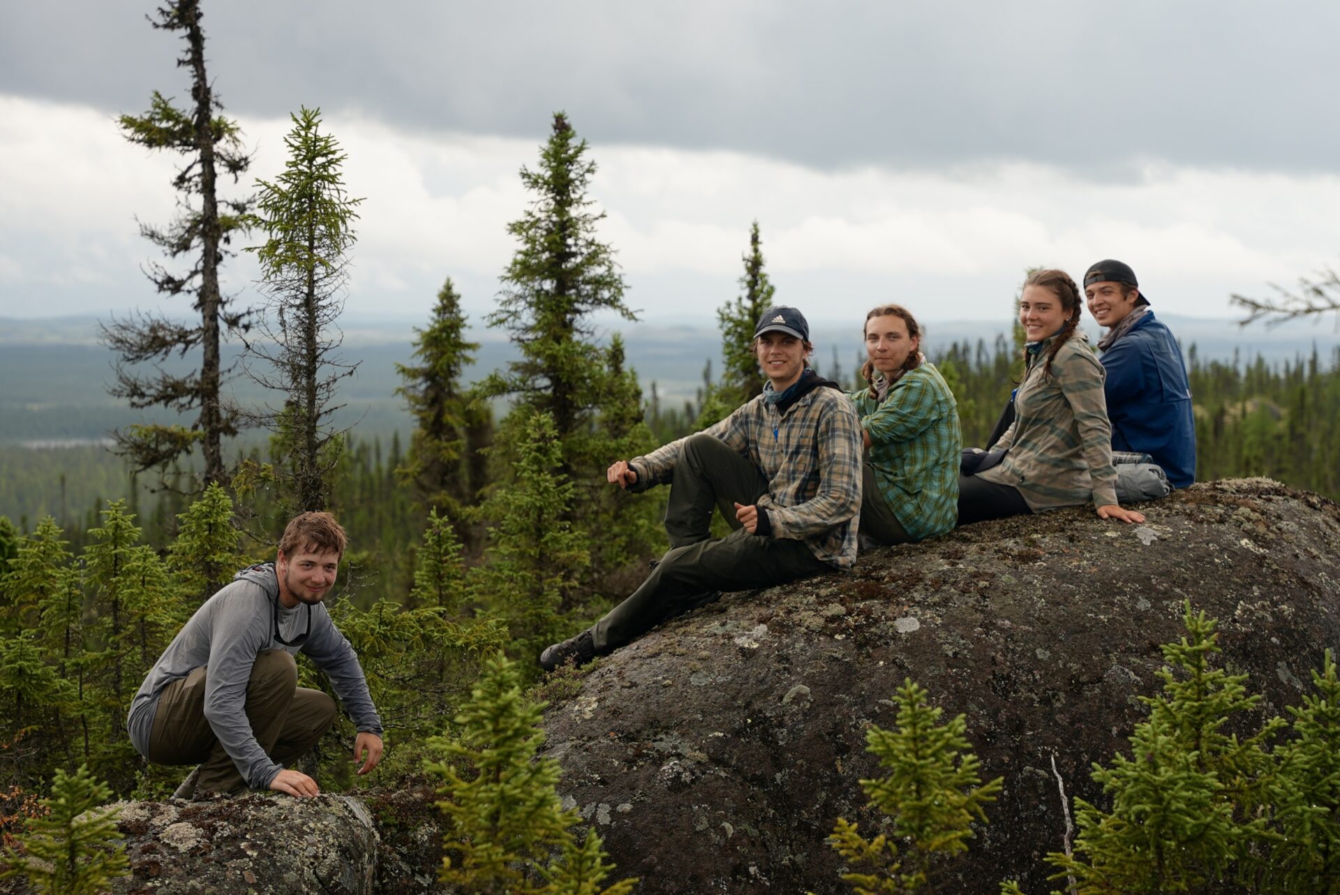 Group hiking in scenic mountain forest