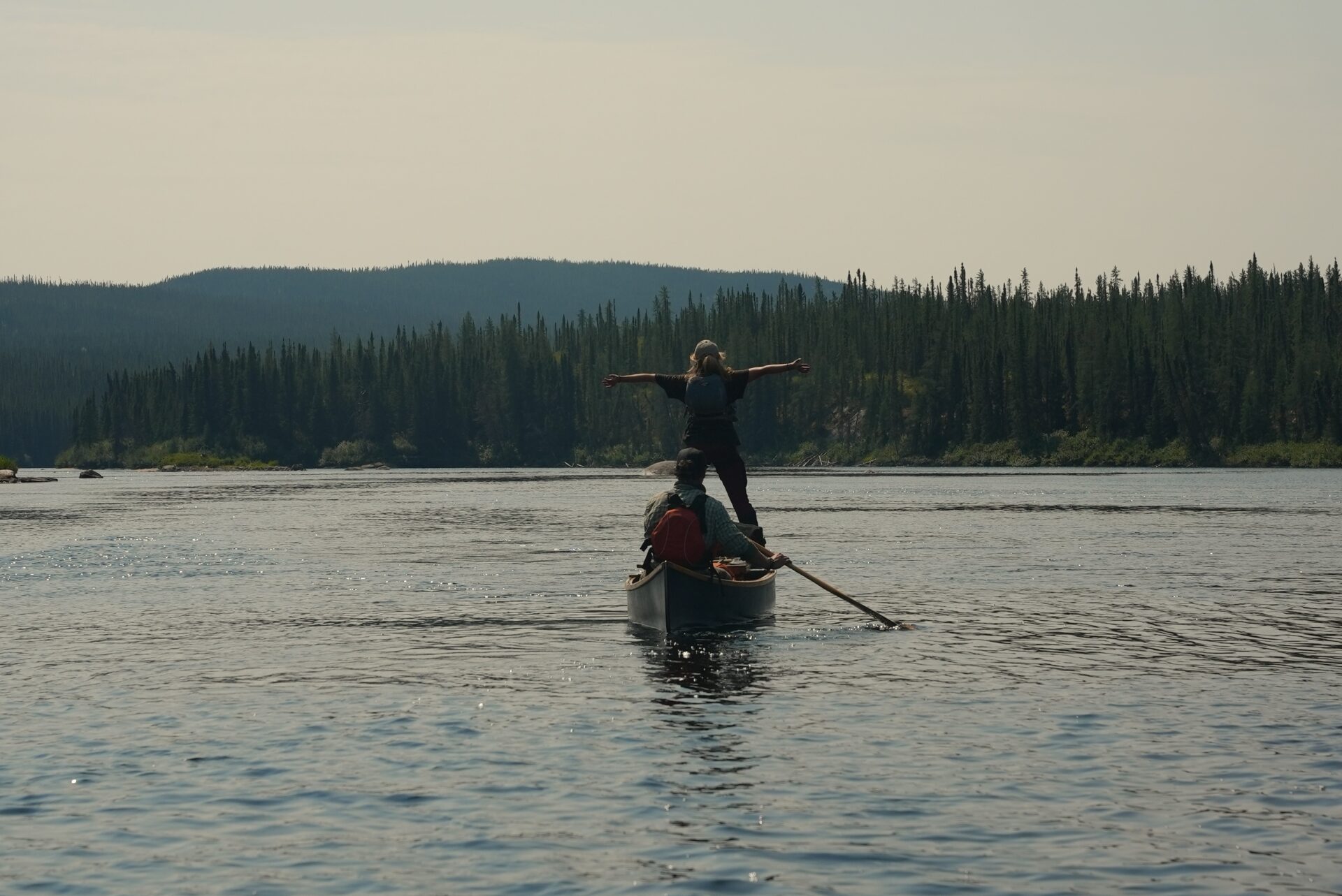 Couple canoeing on a serene lake