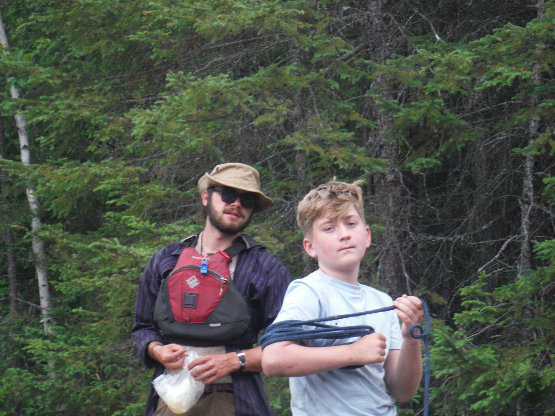 Two people outdoors in a forest