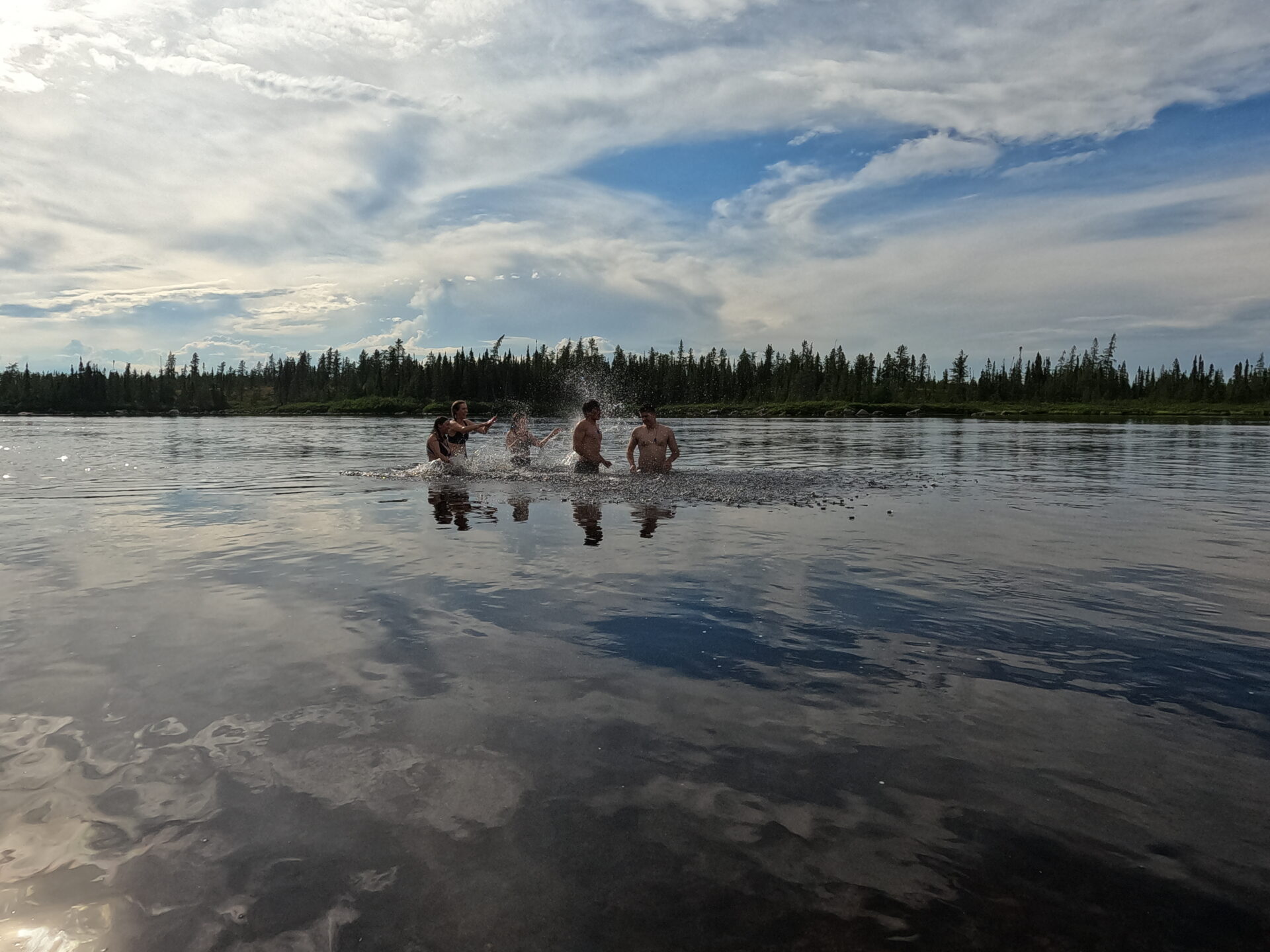 People splashing in a lake