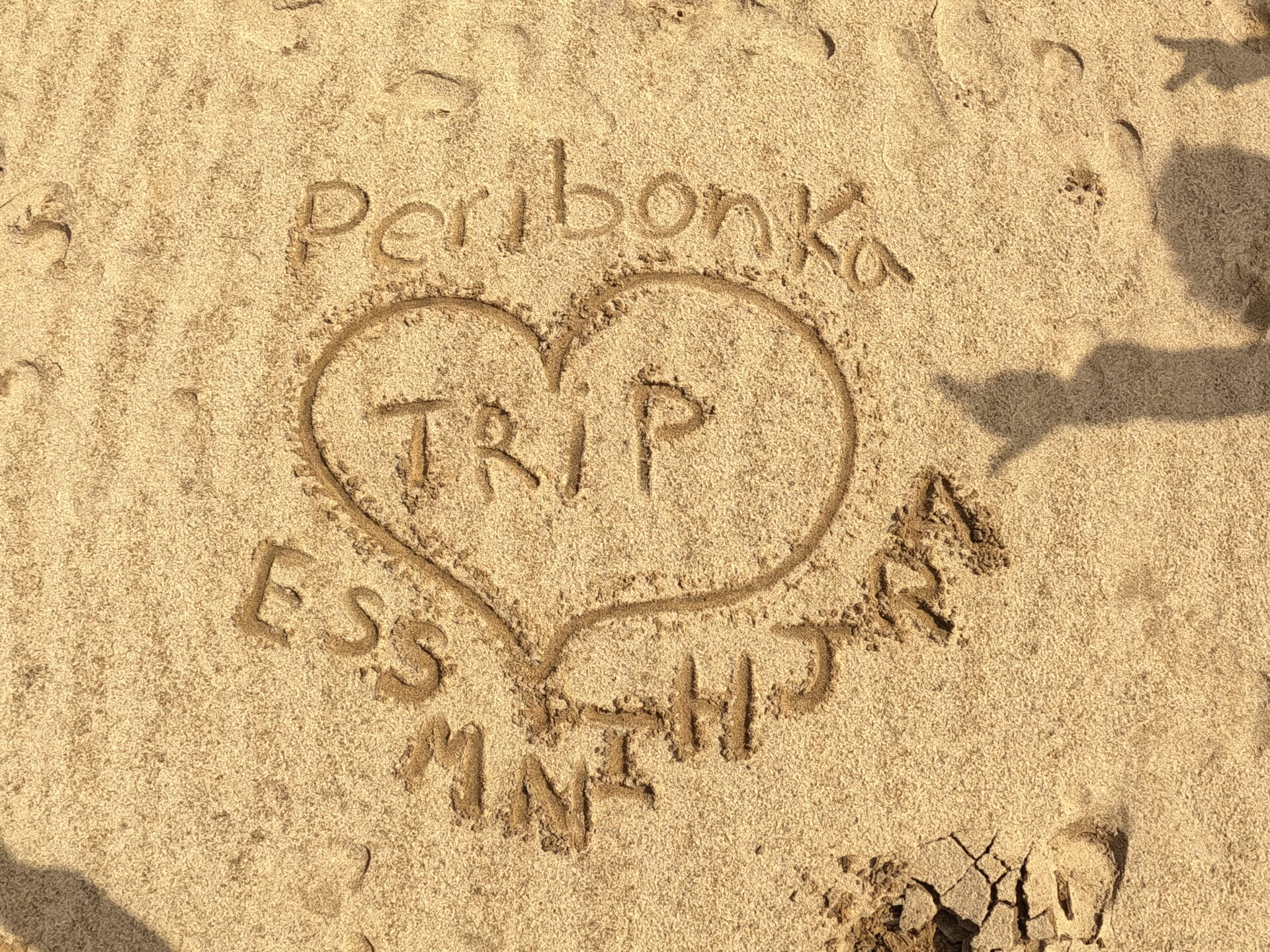 Peribonka trip message in sand