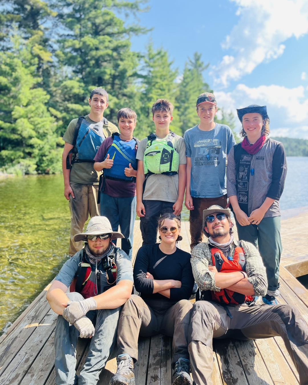 Group on a dock beside a lake