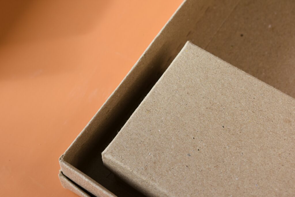 Empty cardboard boxes on orange background