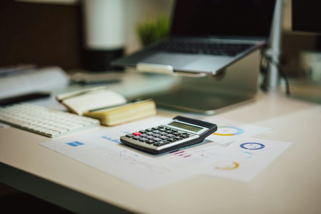 Office desk with calculator and documents