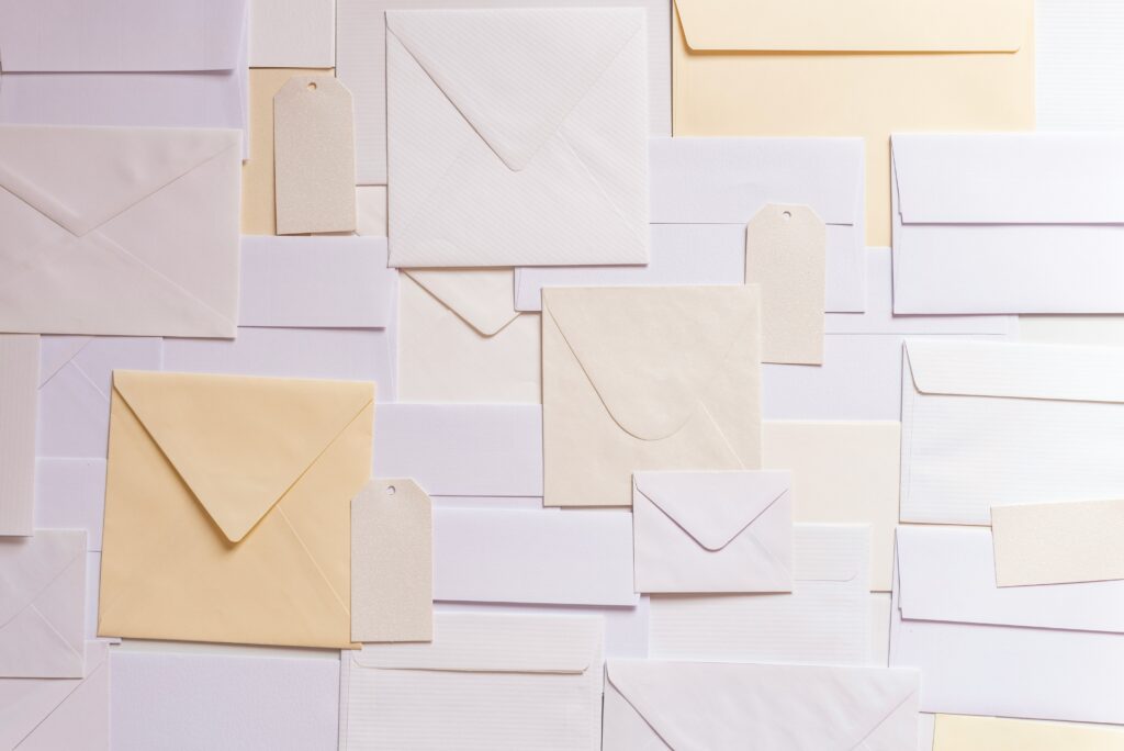 Various envelopes and tags on a flat surface.