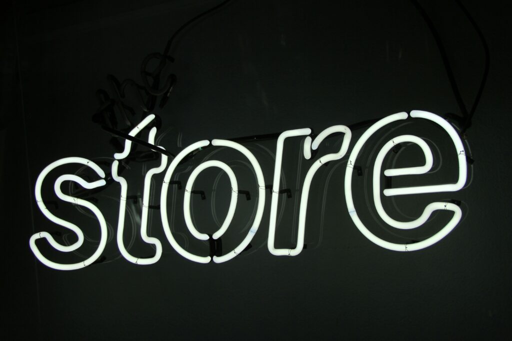 Neon sign reading 'store'