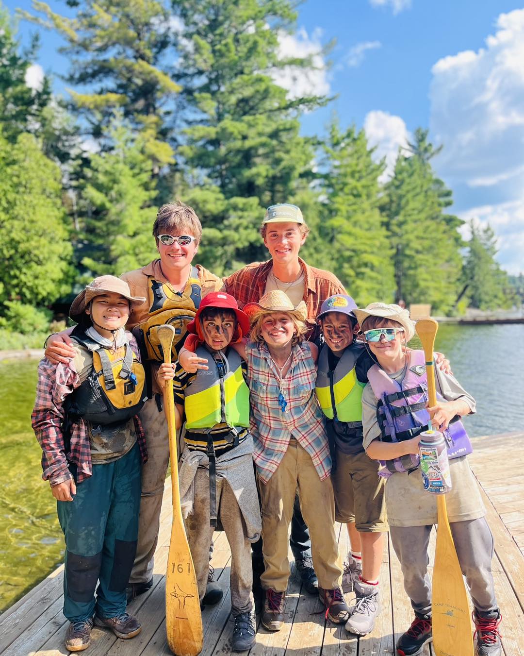 Group of kids and adults by the lake