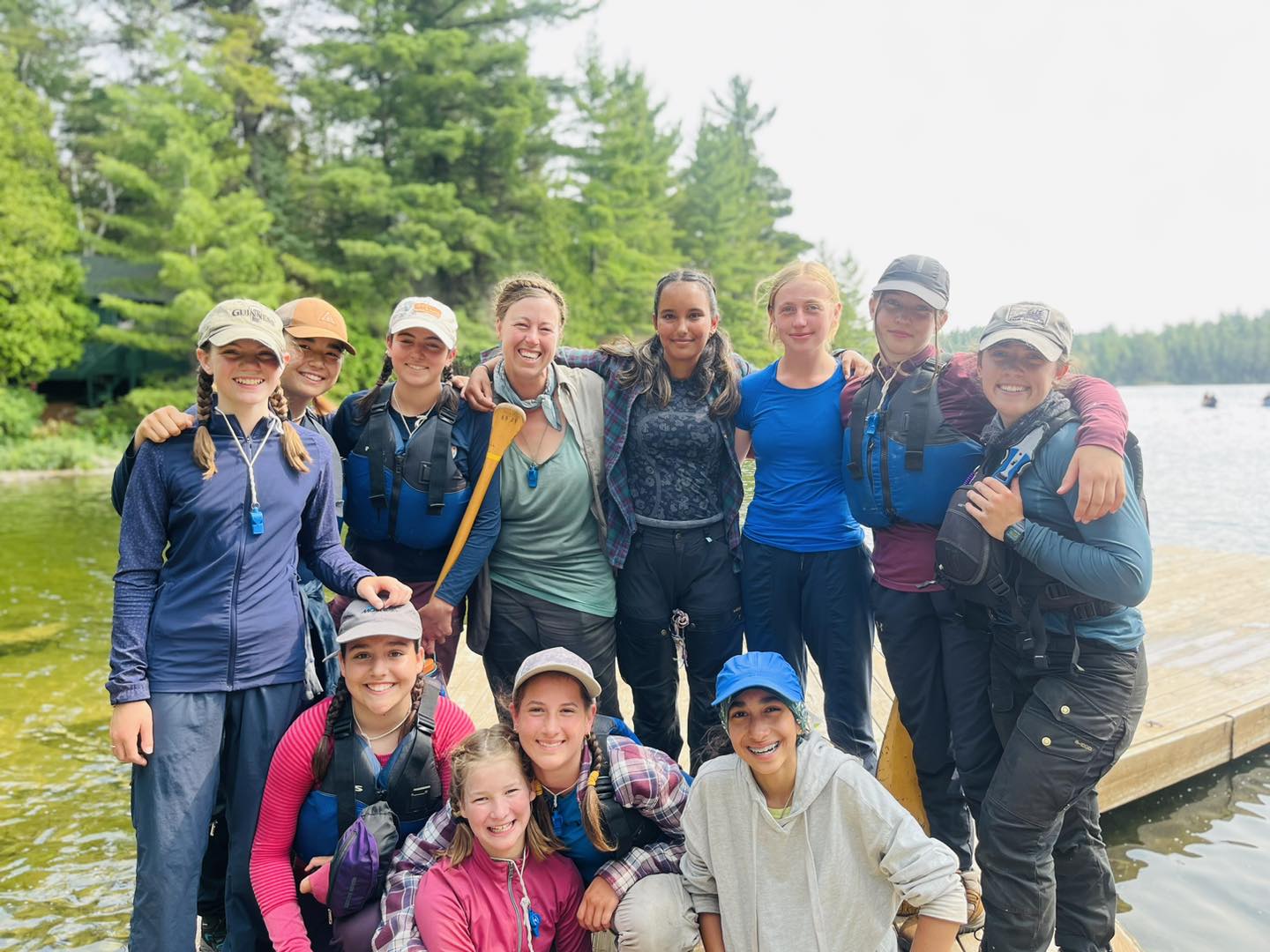 Group of happy people on lake pier