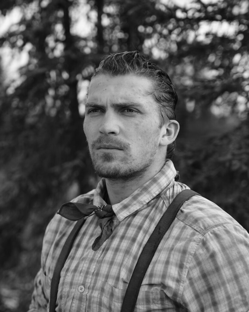 Vintage portrait of a serious man in plaid shirt.