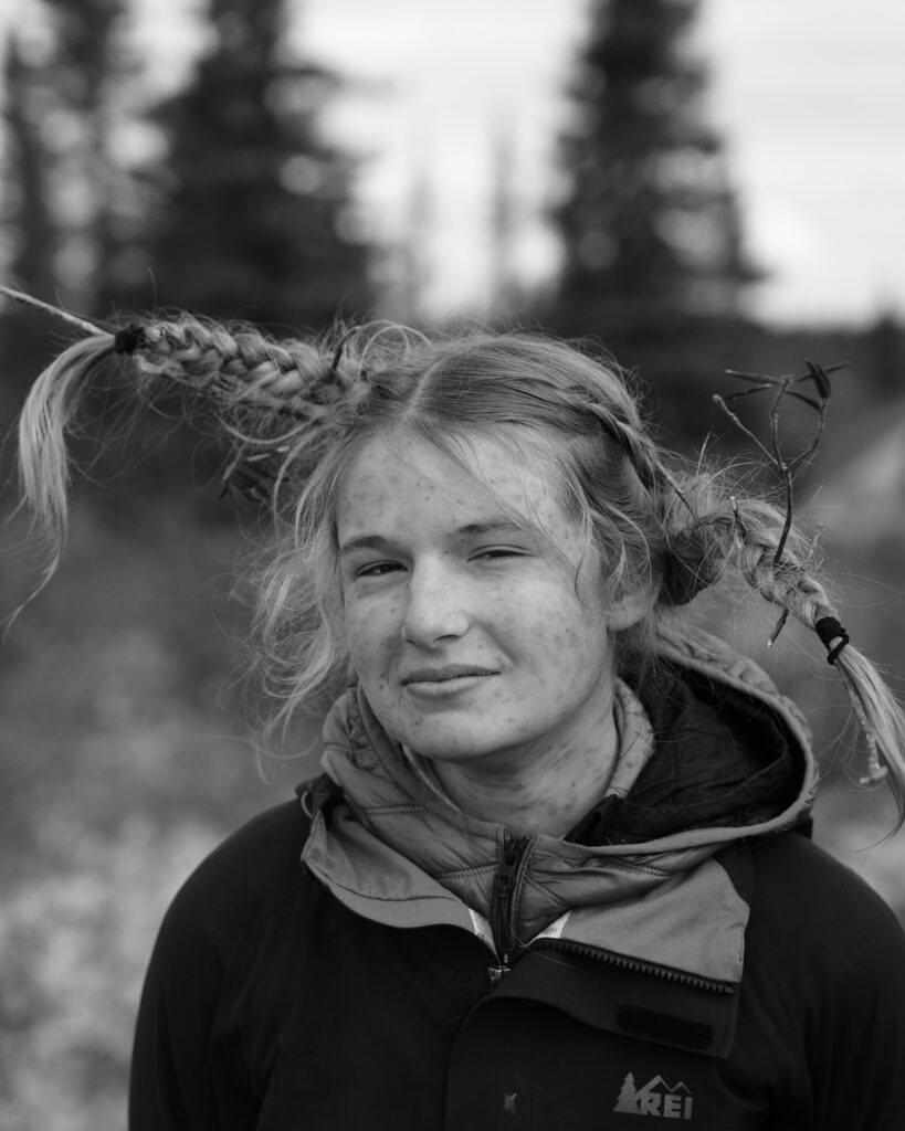 Person with unique braided hairstyle outdoors